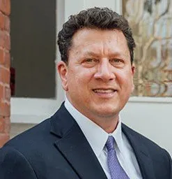 Ted Cranias, Lead Consultant at Brant Hickey Orlando, in a dark suit and tie